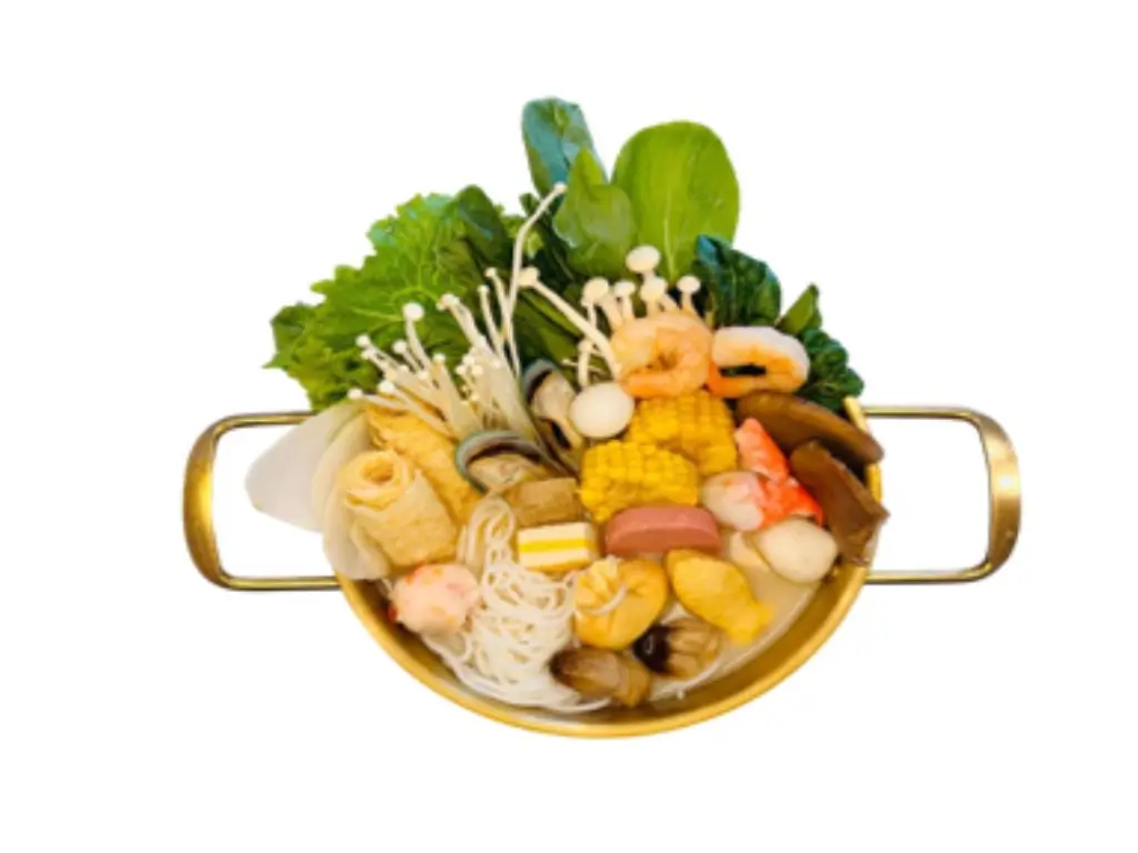 Creamy tonkotsu pork bone broth hot pot with ingredients such as noodles, shrimp, corn, and vegetables at Sushi Naru Pho, a Asian Fusion Restaurant in Charlotte