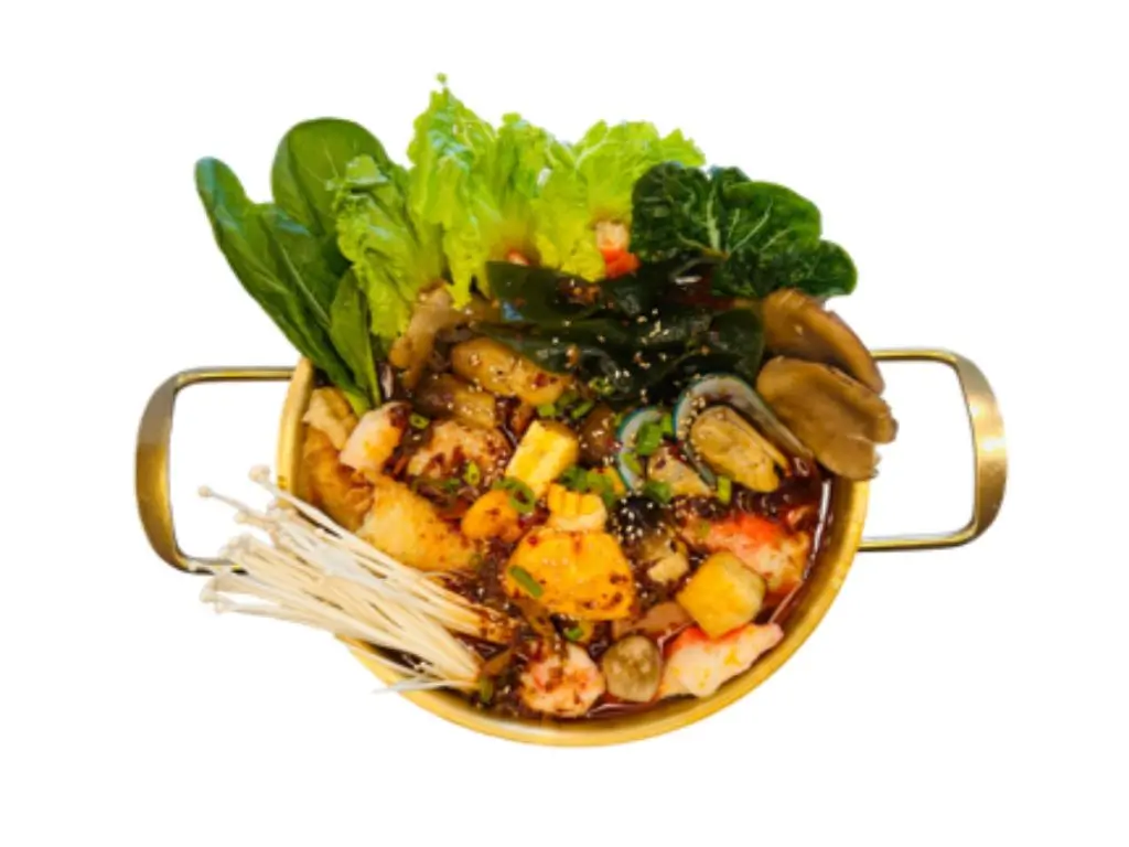 Spicy and numbing hot pot base with assorted ingredients like vegetables, mushrooms, and seafood at Sushi Naru Pho, a Asian Fusion Restaurant in Charlotte
