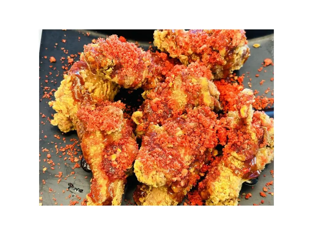 Fried chicken wings coated with Hot Cheetos crisps and sauce at Sushi Naru Pho, a Asian Fusion Restaurant in Charlotte