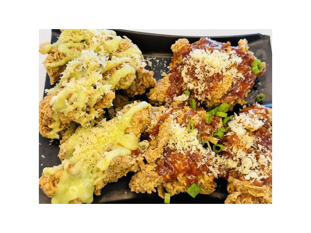 Fried chicken drumsticks glazed with honey - wasabi and sweet - spicy sauce at Sushi Naru Pho, a Asian Fusion Restaurant in Charlotte